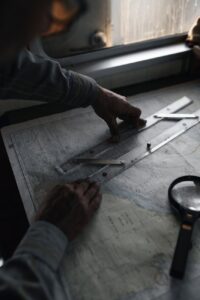man measuring distance on map