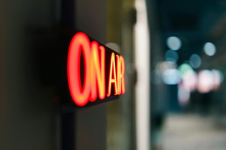 illuminated on air sign in studio setting