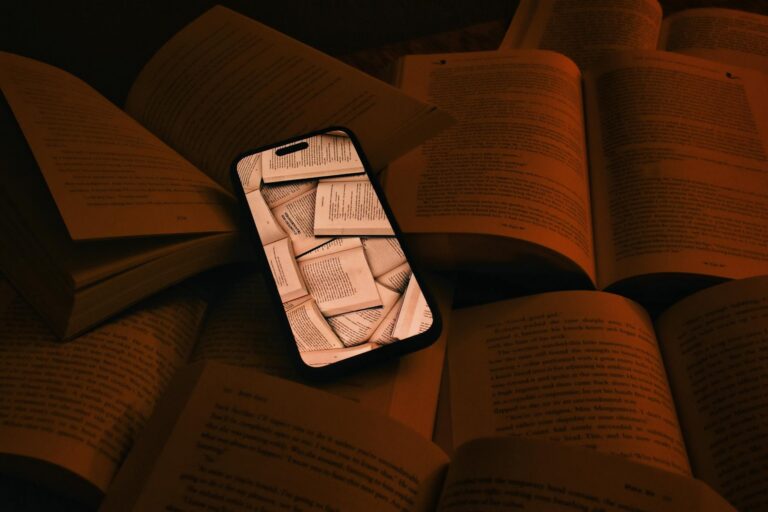 digital age reading phone amidst books