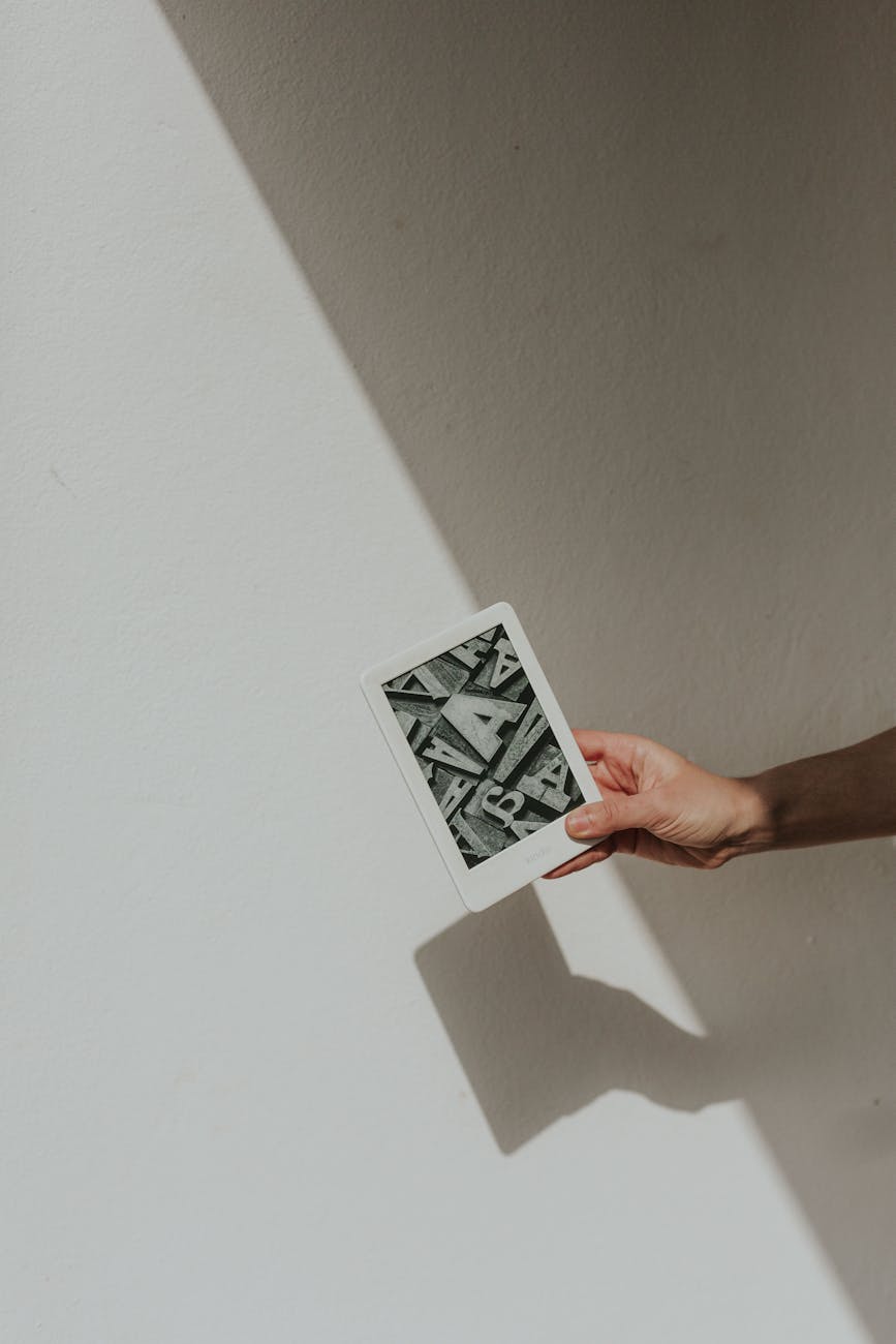 modern minimalist photo of a hand holding device